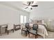 Bright bedroom with ceiling fan, large bed, desk, and chairs; a relaxing retreat at 314 Royal Crescent Ln, Waxhaw, NC 28173