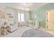 Cozy Bedroom with chandelier, crib, soft chair, and round rug offers a calm space at 314 Royal Crescent Ln, Waxhaw, NC 28173