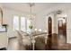 Dining room with hardwood floors, large windows, and a decorative chandelier at 314 Royal Crescent Ln, Waxhaw, NC 28173