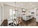 Open kitchen and dining area with stainless steel appliances and spacious island at 314 Royal Crescent Ln, Waxhaw, NC 28173