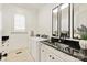 Bright laundry room features granite counters, black fixtures, and a window with white shutters at 314 Royal Crescent Ln, Waxhaw, NC 28173