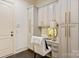 Home office featuring custom built-in cabinets, desk and plenty of natural light at 314 Royal Crescent Ln, Waxhaw, NC 28173