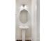 Bathroom with sink and oval mirror at 3215 Isenhour St, Charlotte, NC 28206