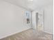 Bright bedroom featuring a neutral color palette and a window bringing in natural light at 3215 Isenhour St, Charlotte, NC 28206
