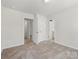 Neutral bedroom featuring doorways leading to other rooms in the home at 3215 Isenhour St, Charlotte, NC 28206
