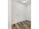Clean entryway with light walls, wood-look floors, and a simple white door at 3215 Isenhour St, Charlotte, NC 28206