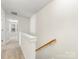 Hallway with carpeted floors and staircase at 3215 Isenhour St, Charlotte, NC 28206