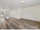 Open concept living room with wood flooring and natural light at 3215 Isenhour St, Charlotte, NC 28206