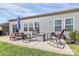 Outdoor space with a patio, chairs, table and outdoor fire pit perfect for outdoor entertainment at 3532 Tully Ave, Kannapolis, NC 28081