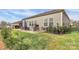 Enjoy outdoor living with a patio, chairs, grill, and lush green yard at 3532 Tully Ave, Kannapolis, NC 28081
