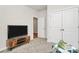Bedroom featuring a TV, a wood entertainment center, and a closet with white doors at 3532 Tully Ave, Kannapolis, NC 28081