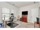 Office space with an executive chair, a desk, a TV, and a window for natural light at 3532 Tully Ave, Kannapolis, NC 28081