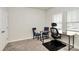 Office room with two chairs, desk and modern computer chair in front of a window for great lighting at 3532 Tully Ave, Kannapolis, NC 28081