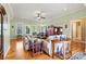 Bright living room featuring hardwood floors, neutral wall color, and ample natural light from the windows at 3701 Fieldhaven Ct, Maiden, NC 28650