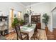 Cozy dining room featuring a large window, built-in cabinets, and ample space for entertaining guests at 4321 Rolling Acres Rd, Charlotte, NC 28213