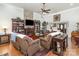 Inviting living room with a stone fireplace, built-in bookshelves, and comfortable seating for relaxing and entertaining at 4321 Rolling Acres Rd, Charlotte, NC 28213