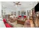 Bright, open living room featuring wood floors, a beamed ceiling, and lots of natural light at 4321 Rolling Acres Rd, Charlotte, NC 28213