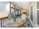 Relaxing sunroom featuring natural light, a ceiling fan, and a dining table, perfect for enjoying meals and entertaining guests at 4321 Rolling Acres Rd, Charlotte, NC 28213