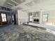 Living room with a fireplace, bright windows, showing drywall and some interior construction at 44401 Us 52 N Hwy, Richfield, NC 28137