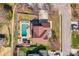Aerial view of property showcasing a large pool, landscaped yard and driveway at 5000 Tulip Ln, Matthews, NC 28104
