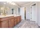 Double sink bathroom with lots of light with a separated toilet area and walk-in shower at 5000 Tulip Ln, Matthews, NC 28104