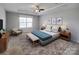 This spacious bedroom offers a ceiling fan and large windows that provide plenty of natural light at 5000 Tulip Ln, Matthews, NC 28104