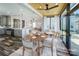 Open floorplan dining and kitchen area with seating for four at the dining table at 5000 Tulip Ln, Matthews, NC 28104