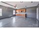 Spacious garage with epoxy flooring, cabinet storage and ample workspace at 5000 Tulip Ln, Matthews, NC 28104