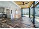 Open concept kitchen and sunroom with wood ceiling and direct access to backyard at 5000 Tulip Ln, Matthews, NC 28104