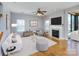 Bright living room with fireplace, hardwood floors, and a modern design scheme at 5000 Tulip Ln, Matthews, NC 28104