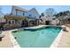 Backyard featuring a private pool, tanning ledge, lounge chairs, and patio area at 5000 Tulip Ln, Matthews, NC 28104