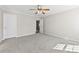 Spacious bedroom featuring a ceiling fan and neutral carpeting at 5140 Hildreth Ct, Concord, NC 28025