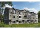 Modern townhome exteriors showcase a mix of colors, multiple windows, and inviting entryways at 550 Beatties Ford Rd, Charlotte, NC 28216