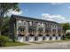 New townhome exteriors showcasing modern architecture, individual balconies, and attached single-car garages at 550 Beatties Ford Rd, Charlotte, NC 28216