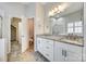 Bright bathroom featuring double sink vanity, granite counters, and a glass-enclosed shower at 565 Sugar Tree Dr, Rock Hill, SC 29732