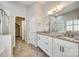 Bright bathroom with a double sink vanity, granite counters, and glass-enclosed shower at 565 Sugar Tree Dr, Rock Hill, SC 29732