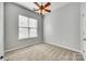 Cozy bedroom features a ceiling fan and a window letting in natural light at 565 Sugar Tree Dr, Rock Hill, SC 29732