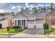 Charming home with a two-car garage, inviting front porch, and well-manicured landscaping at 565 Sugar Tree Dr, Rock Hill, SC 29732