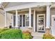 Inviting front porch with classic white columns and manicured landscaping at 565 Sugar Tree Dr, Rock Hill, SC 29732