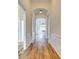 Elegant hallway featuring arched doorways, wood flooring, and decorative wall paneling at 565 Sugar Tree Dr, Rock Hill, SC 29732