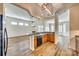 Open kitchen with bar, wood cabinets, and seamless flow to living spaces at 565 Sugar Tree Dr, Rock Hill, SC 29732
