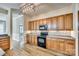 Stylish kitchen featuring wooden cabinetry, a tile backsplash, and modern appliances at 565 Sugar Tree Dr, Rock Hill, SC 29732