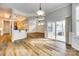 Bright open-concept living space with hardwood floors and a sliding door to the outdoor patio at 565 Sugar Tree Dr, Rock Hill, SC 29732