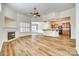 Open-concept living room connected to a well-equipped kitchen with wood cabinets at 565 Sugar Tree Dr, Rock Hill, SC 29732