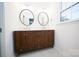 Bathroom features a double sink vanity with marble countertop and decorative mirrors at 5925 Carmel Station Ave, Charlotte, NC 28226