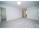 Large bedroom with plush carpet and natural light, providing a serene retreat at 5925 Carmel Station Ave, Charlotte, NC 28226