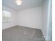 Bright bedroom featuring neutral walls, plush carpeting, and natural light at 5925 Carmel Station Ave, Charlotte, NC 28226