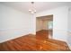 Bright, open dining room featuring hardwood floors and elegant trim at 5925 Carmel Station Ave, Charlotte, NC 28226