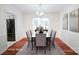 Elegant dining room with a modern chandelier, seating for six, and refined decor at 5925 Carmel Station Ave, Charlotte, NC 28226