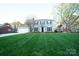 Charming two-story home with a well-manicured lawn and attached two car garage at 5925 Carmel Station Ave, Charlotte, NC 28226